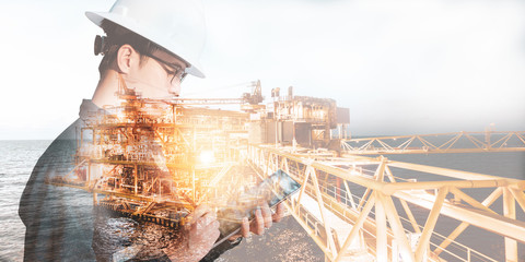 Double exposure of Engineer or Technician man with safety helmet operated platform or plant by...