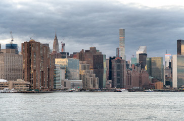 Sunset reflections of Midtown Manhattan, view from the river at dusk, New York City