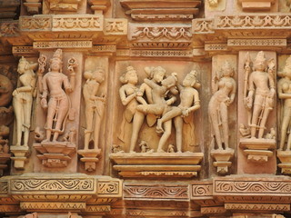 The Western group of Khajuraho temples, a UNESCO heritage site, is famous for its erotic sculptures, India, clear day.