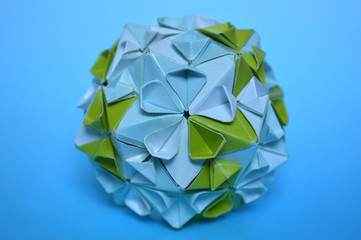 Modular origami, cherry blossom, on blue background