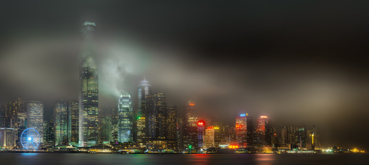Skyline of Hong Kong in mist, view from Kowloon island, China