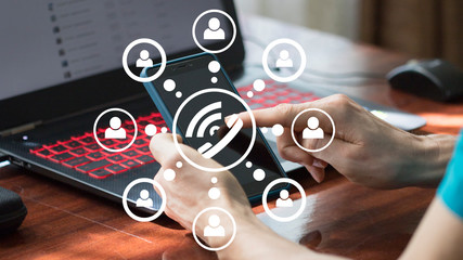 Businessman presses button phone on virtual electronic user interface. Business call at work.