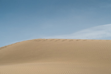 Desert landscape with Blue Sky and Wave pattern in sand, Spain