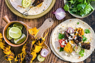 Homemade tasty doner kebab with fresh salad roasted meat served in tortilla wraps with fresh salad.