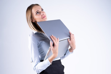 woman with laptop in hand on white background