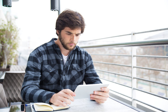 Focused professional keep working in cafe - Powered by Adobe
