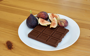 Chocolate With fruit Figs on white plate