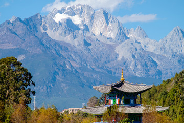 Fototapeta na wymiar Jade Dragon Snow Mountain and a Pagoda