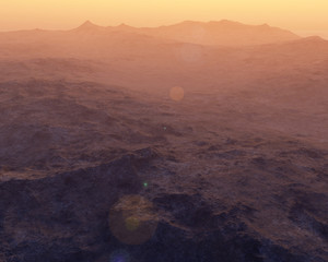 Rocky mountains in hazy sunrise.