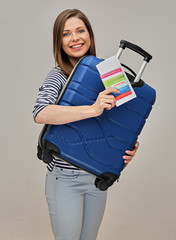 woman tourist standing with travel case and document