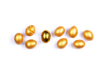Golden colored Easter eggs isolated on white background. Place for text.