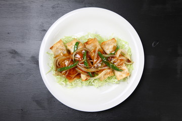 Stick shaped dumplings with sweet and sour sauce