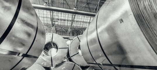Industrial warehouse with rolls of steel sheet in a plant galvanized steel coil