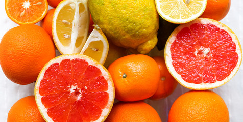 many sliced citrus fruits are on the table