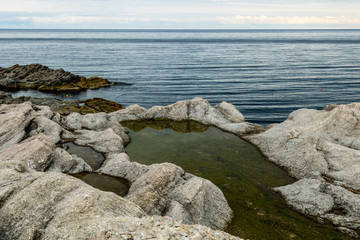 Fototapeta na wymiar Spring beach, Cow Head Peninsula, Newfoundland, Canada