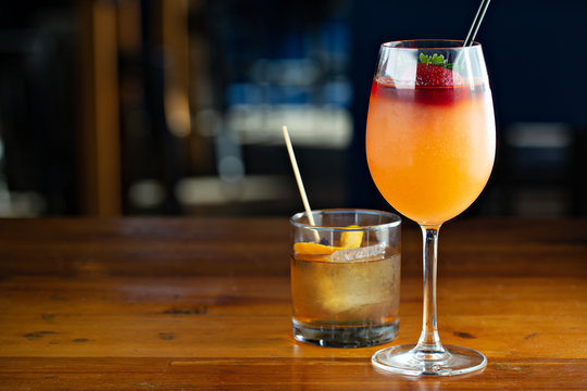 Frose cocktail with strawberry on the bartop, frozen rose