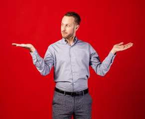 man holding palms up as scale or balance.