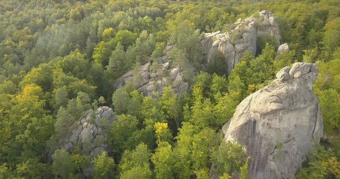 Aerial view to Dovbush Rocks in Bubnyshche - a legendary place, the ancient cave monastery in fantastic boulders amidst beautiful scenic forests, popular with tourists and travelers in Eastern Europe 