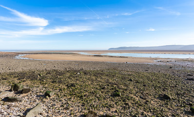 Fototapeta na wymiar Low tide at Red Wharf bay in Anglesey, North Wales, UK