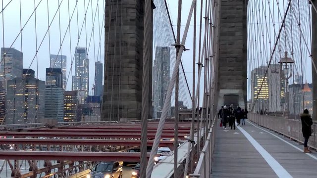 NEW YORK CITY - DECEMBER 4, 2018: Slow Motion of traffic along the Brooklyn Bridge. The city attracts 50 million people annually