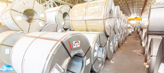 Industrial warehouse with rolls of steel sheet in a plant galvanized steel coil