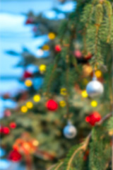 Christmas toys on the tree in the room close-up