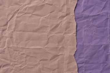 pieces of creased brown and violet paper  background texture