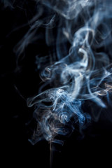 Close-up abstract beautiful smoke on a black isolated background. Blur and soft focus.