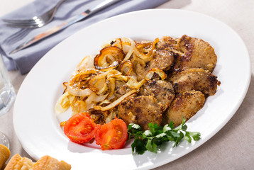 Fototapeta premium Fried rabbit liver with onion