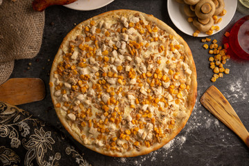 Pizza with chicken, mushrooms and sweet corn