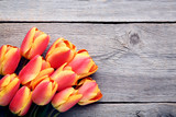 Bouquet of tulips on grey wooden table