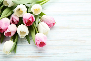 Bouquet of tulips on wooden table