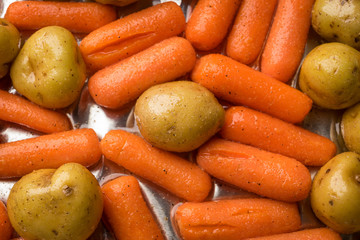 Small potatoes and baby carrots are ready for the oven