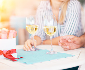 Close up of hand with wine glasses