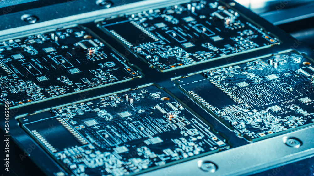 Poster factory machinery at work: printed circuit board being assembled with automated robotic arm, pick an