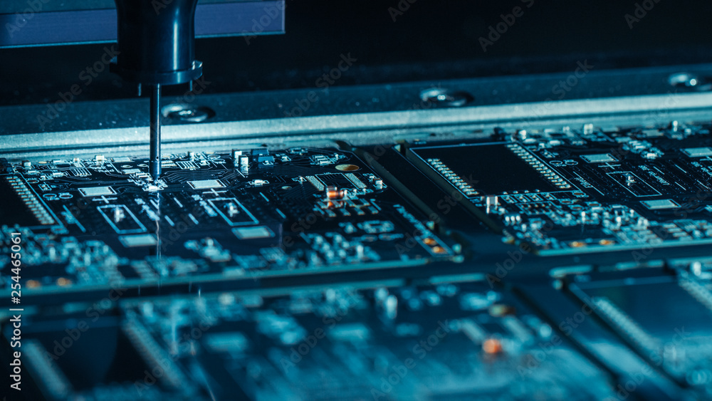 Poster factory machinery at work: printed circuit board being assembled with automated robotic arm, pick an