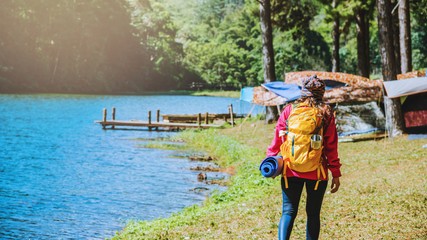 Asian woman travel nature. Travel to relax and yoga exercise at the lake  pang ung in Mae Hong Son, Thailand