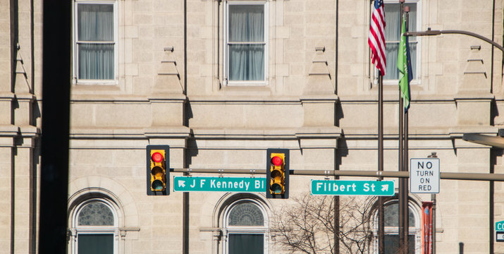 J F Kennedy blvd and Filbert Street signs on a traffic light pole in center street Philadelphia.
