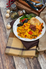 Paella with chicken, seafood and chorizo