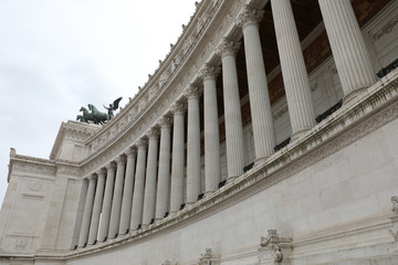huge white colonnade of the monument called Vittoriano in Rome i