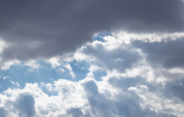 Obraz premium Dark air clouds in the blue sky.