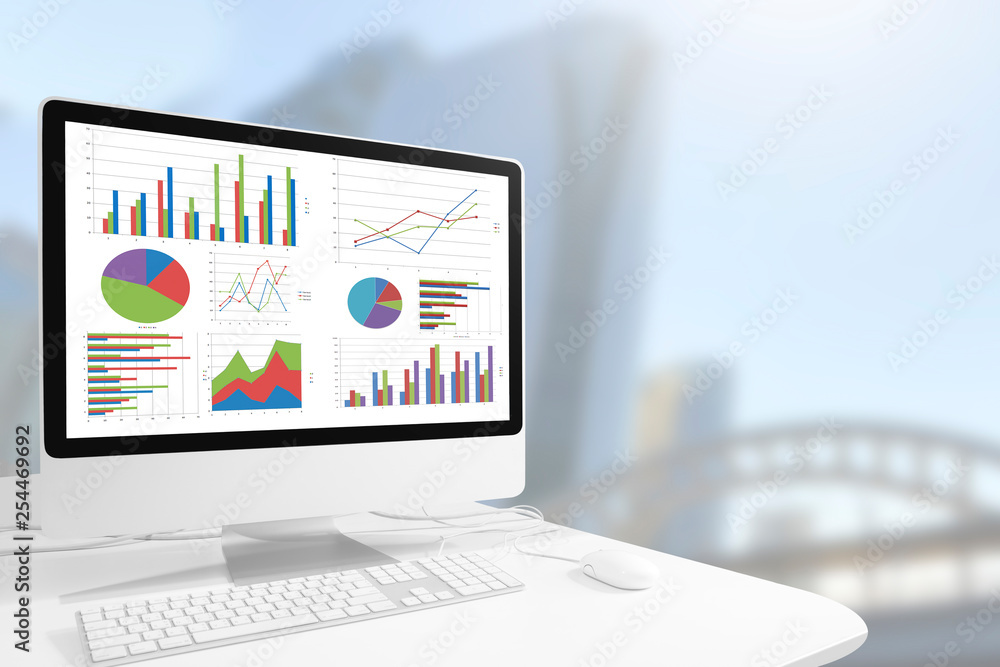 Poster computer showing chart and graph on table against beautiful modern business building background, dig