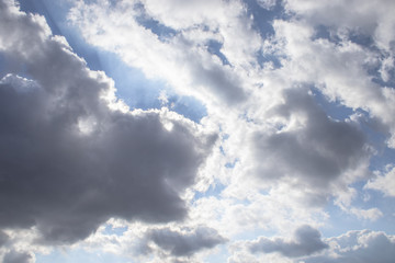 Obraz premium Dark air clouds in the blue sky.