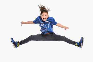 happy kids jumping in air over white background
