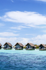 Over water bungalows at a Maldives island resort 