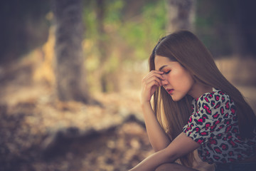 Beautiful thai woman very sad from unrequited love,rethink,think over,vintage style,dark tone,broken heart,asian girl