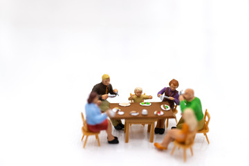 Miniature people:  Families are celebrating , eating together happily. Image use for the concept of family festival.