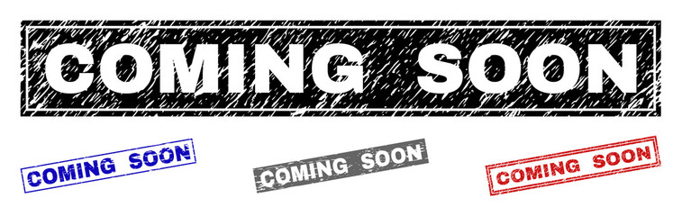 Grunge COMING SOON rectangle stamp seals isolated on a white background. Rectangular seals with grunge texture in red, blue, black and gray colors.