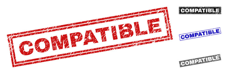 Grunge COMPATIBLE rectangle stamp seals isolated on a white background. Rectangular seals with distress texture in red, blue, black and gray colors.