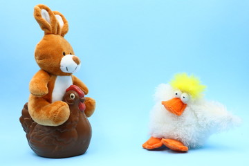 Funny Easter Composition with Teddy Bunny and Chocolate Hen